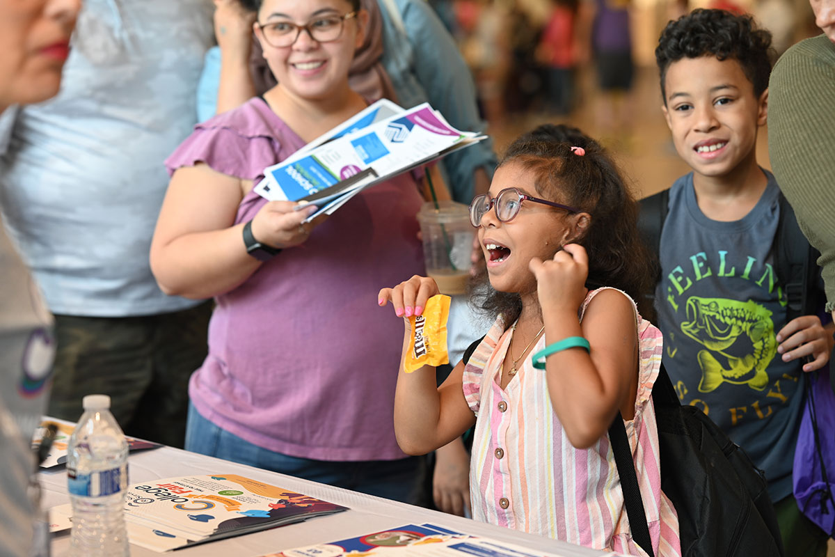 Student getting items at backpack bash