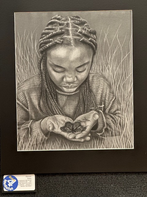 Student artwork of girl holding butterfly