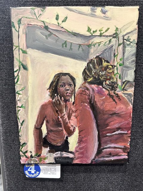 Student artwork of a girl looking into mirror