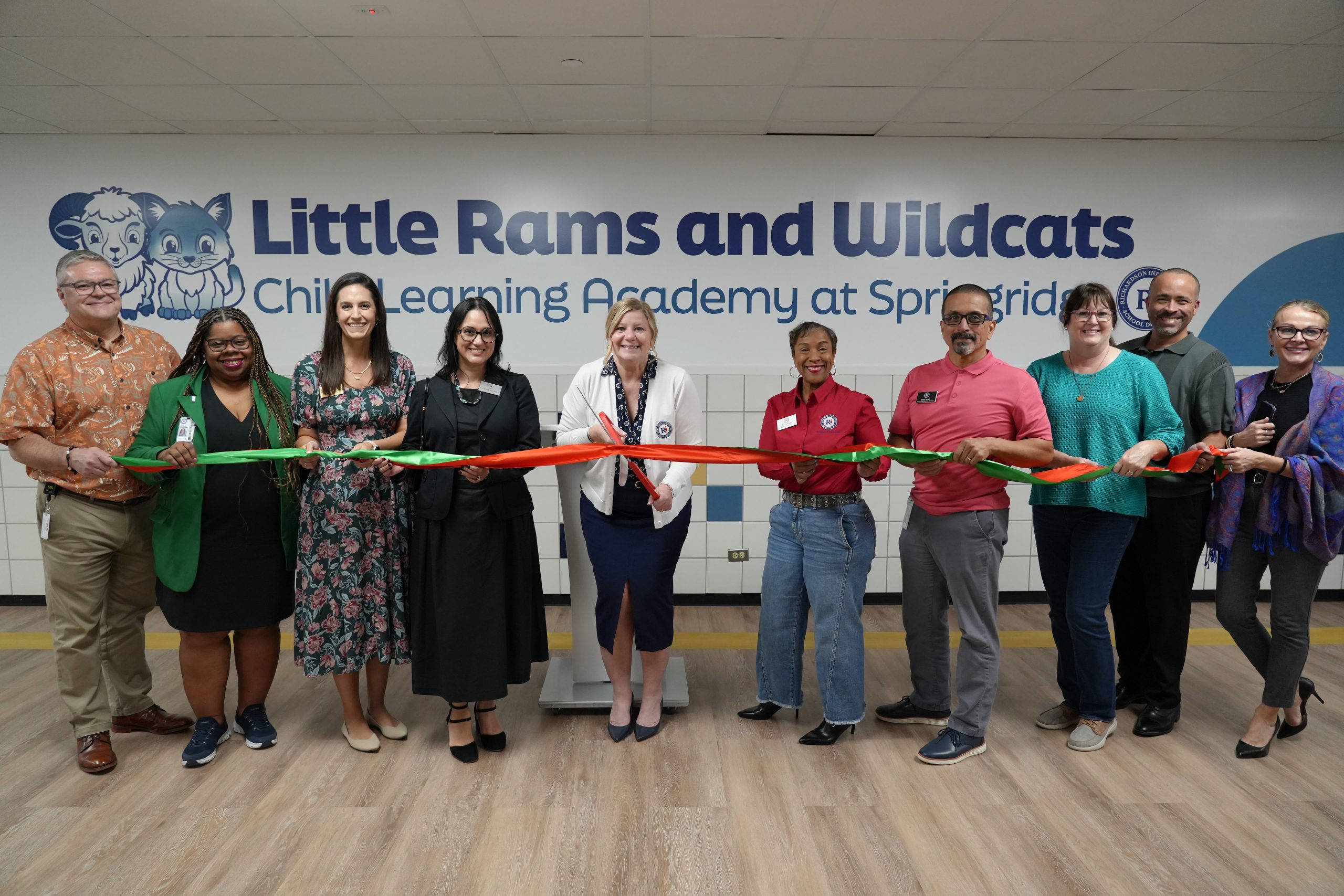 District leadership cutting ribbon at Little Rams and Wildcats Child Learning Academy at Springridge