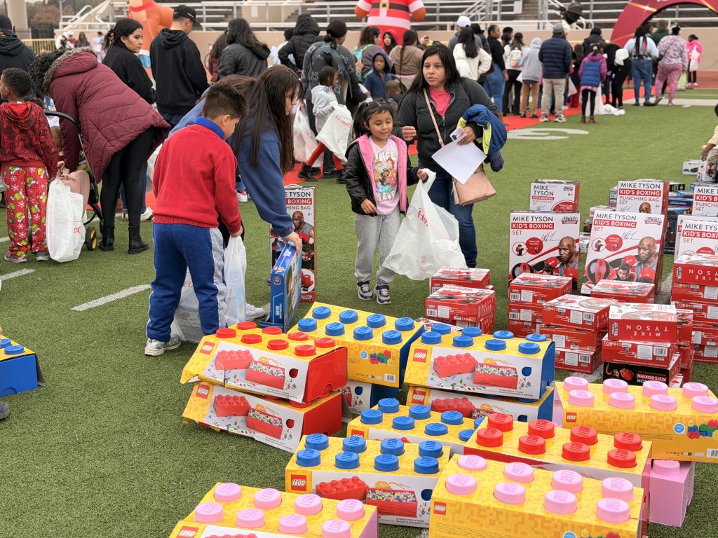 Students and families surrounded by giant lego toys