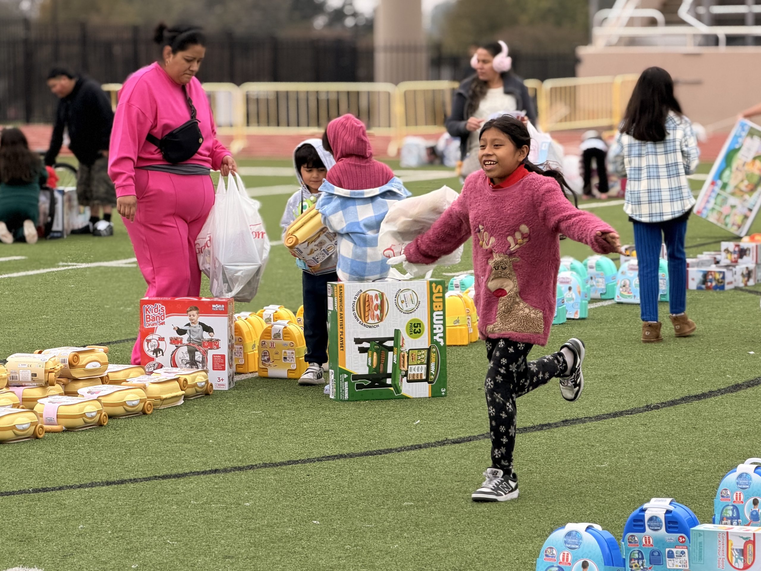 Student running through a field of toys