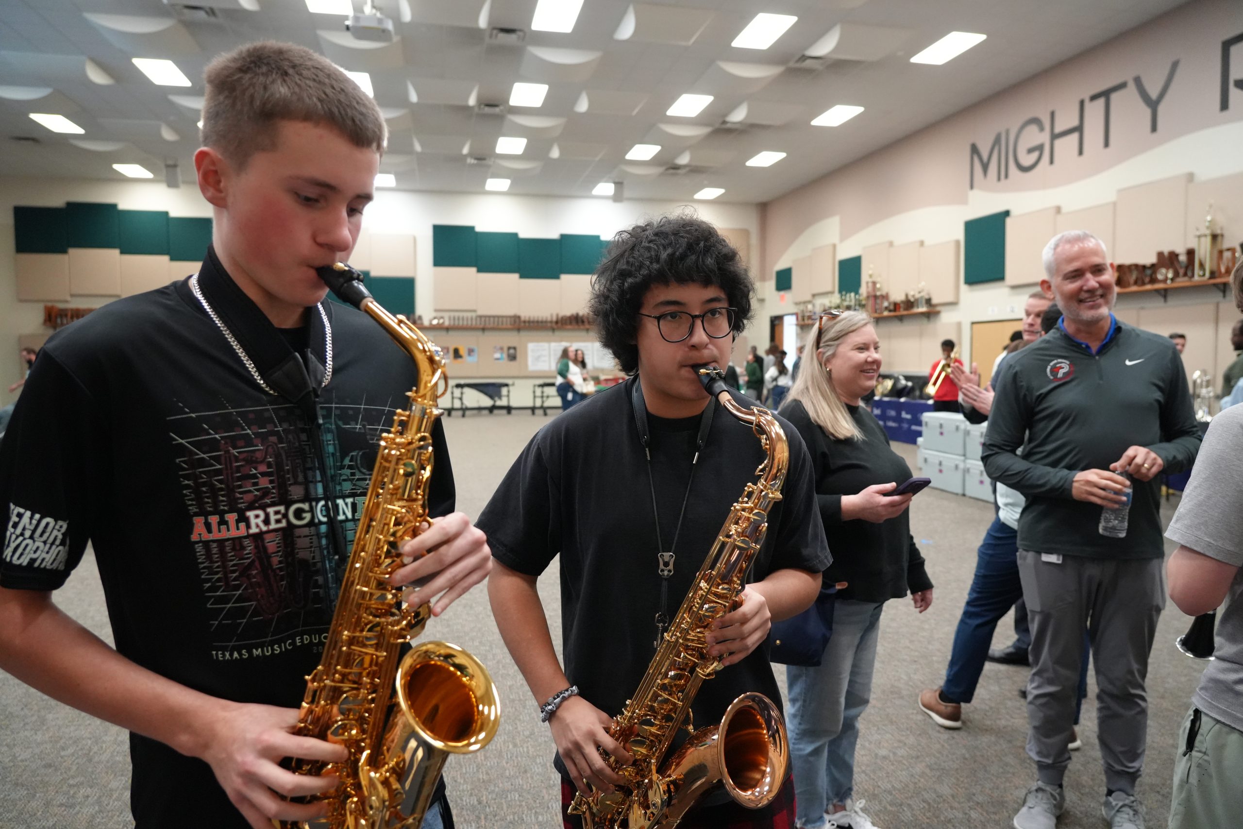Students testing saxophones in BHS band hall