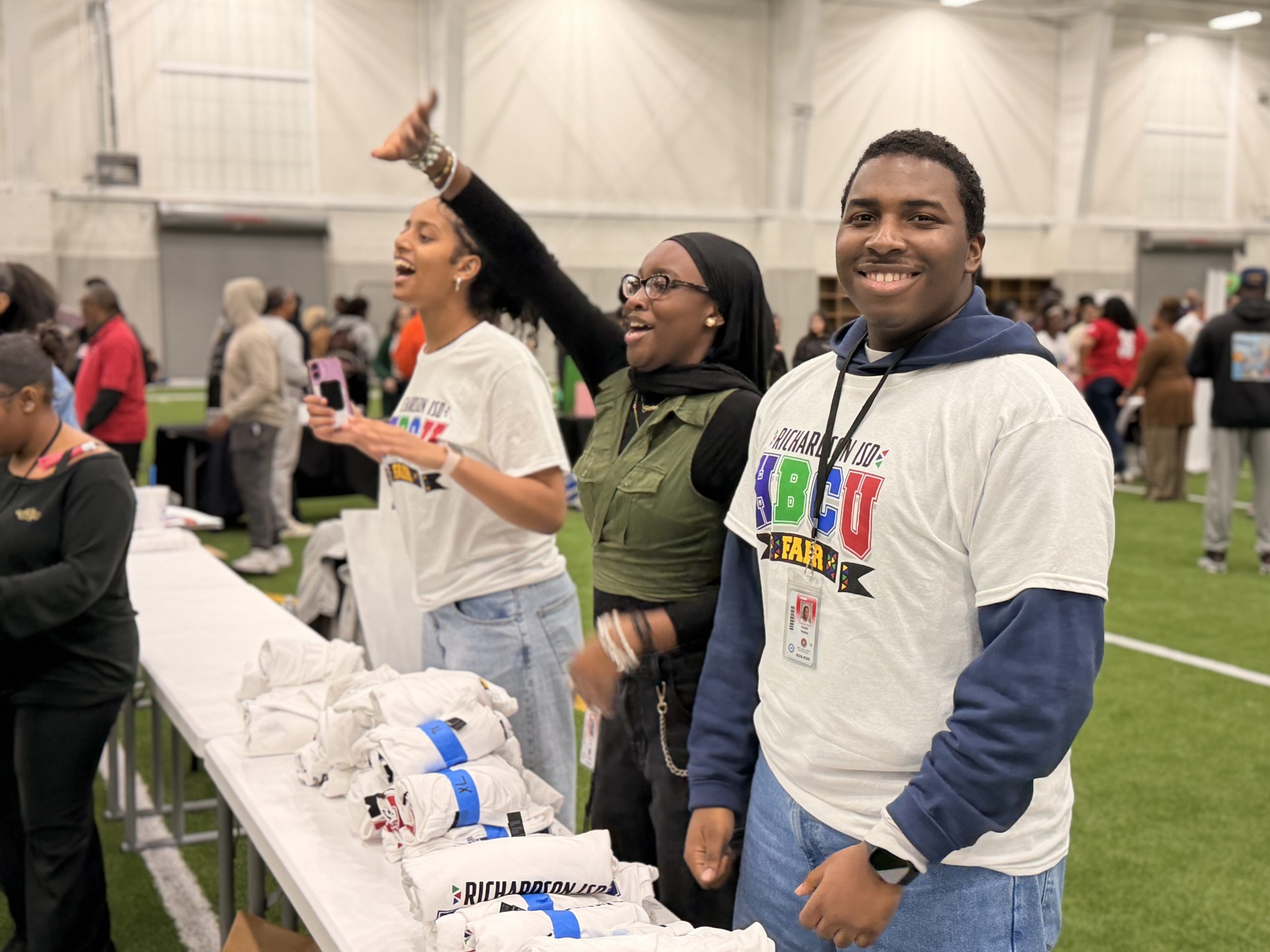 Students greeting attendees at HBCU fair