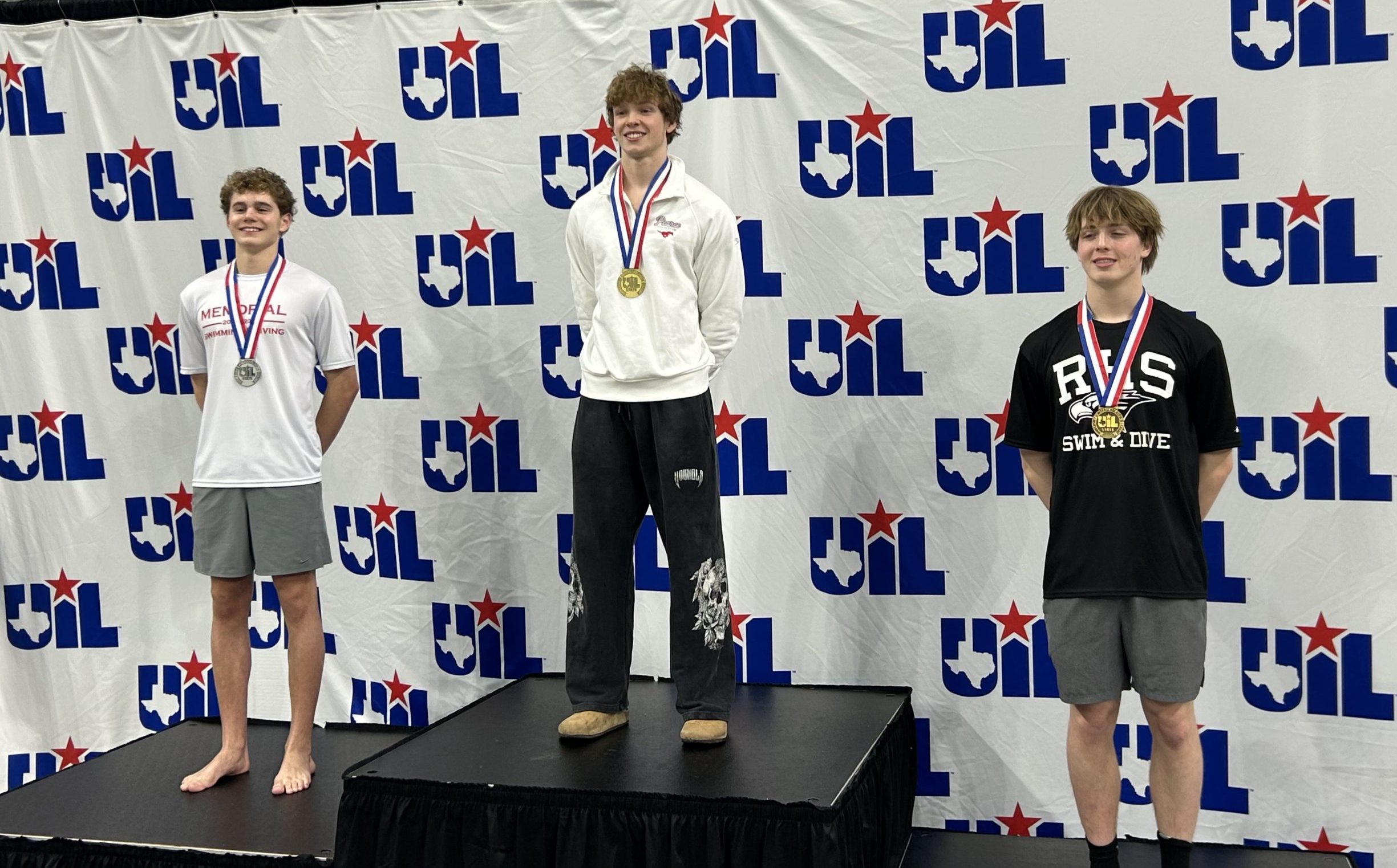 UIL Swimming and Diving Podium with 3 Swimmers with medals