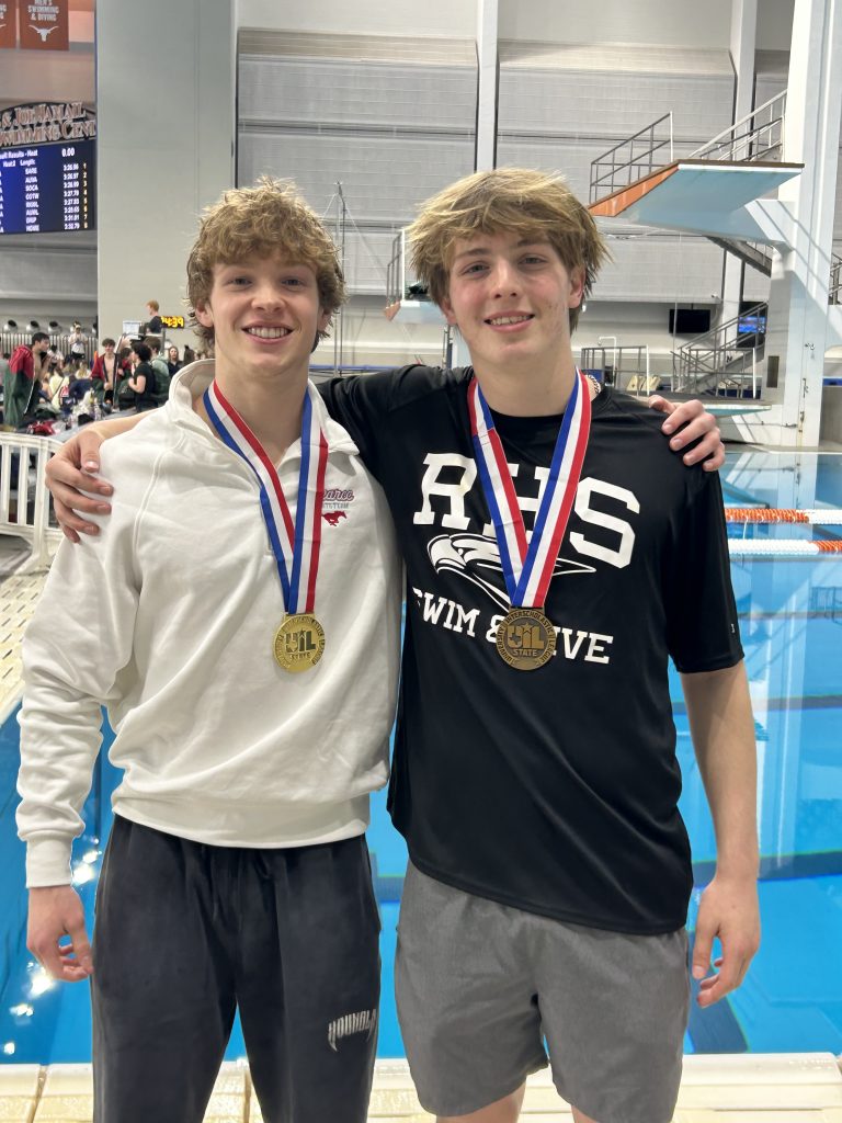 Michael Evans and Graham Rittiluechai by pool with gold and bronze medals