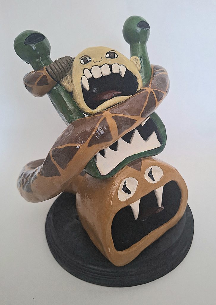 Sculpture of heads with snake - Kaylynn Beighey - Richardson High School