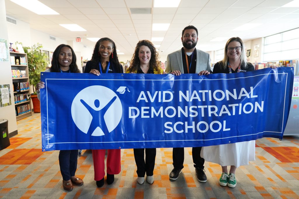 Richardson West Admin team holding AVID National Demonstration School Banner