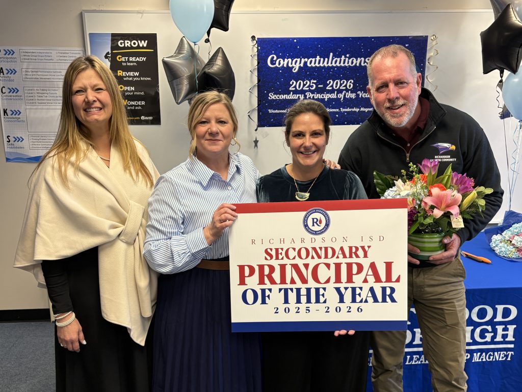 Katie Mottram and Team with POY sign