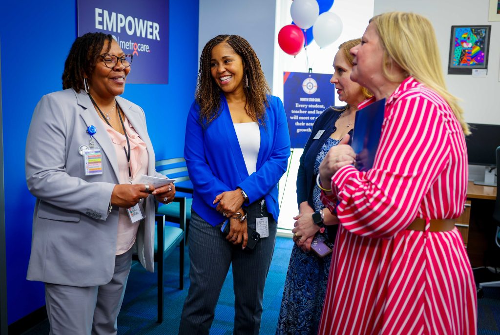 women speaking and laughing