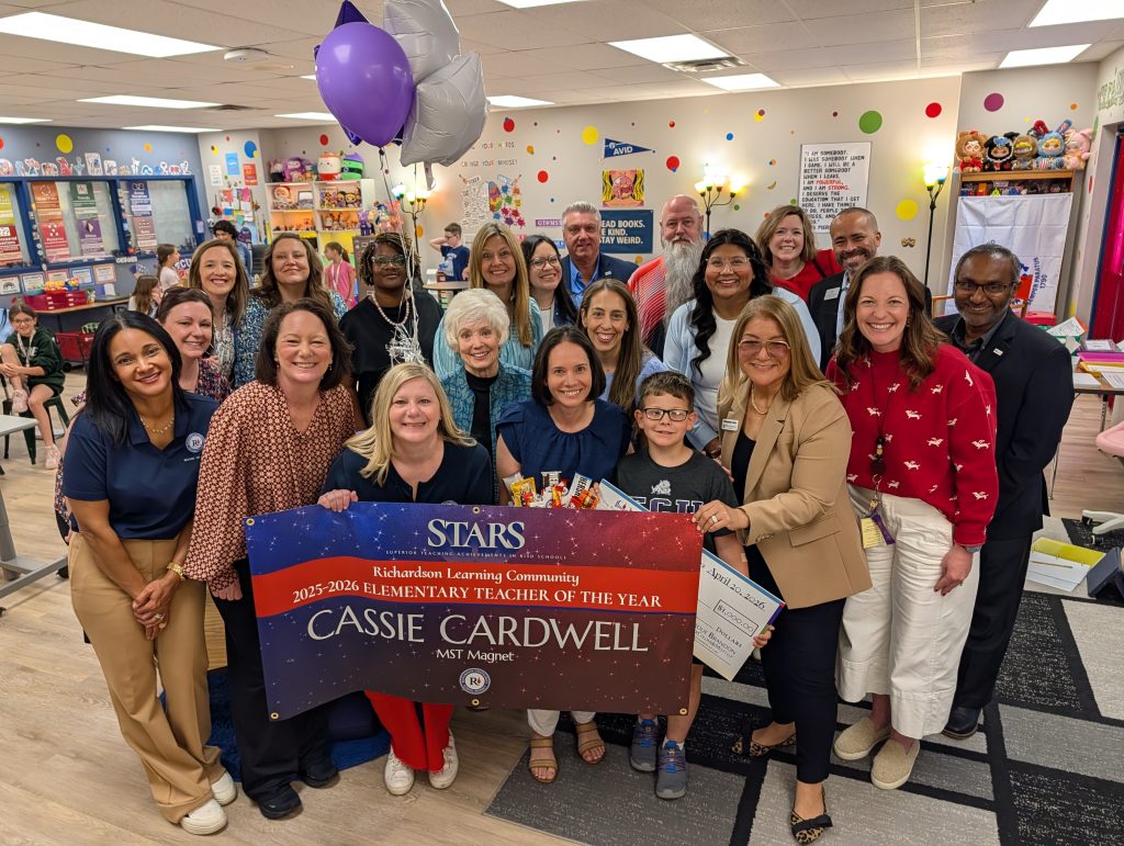 Cassie Cardwell - MST holding STARS teacher sign, big check, surrounded by prize patrol