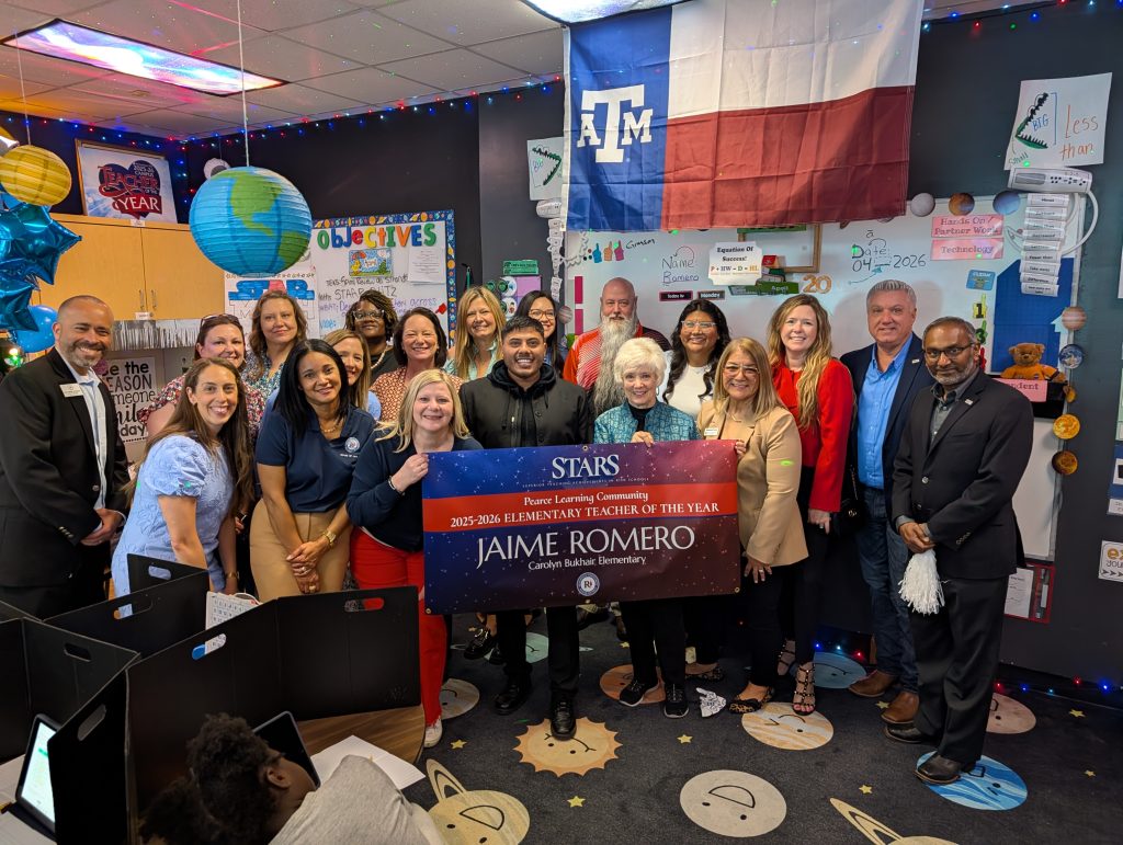 Jaime Romero - CBE holding STARS teacher sign, big check, surrounded by prize patrol