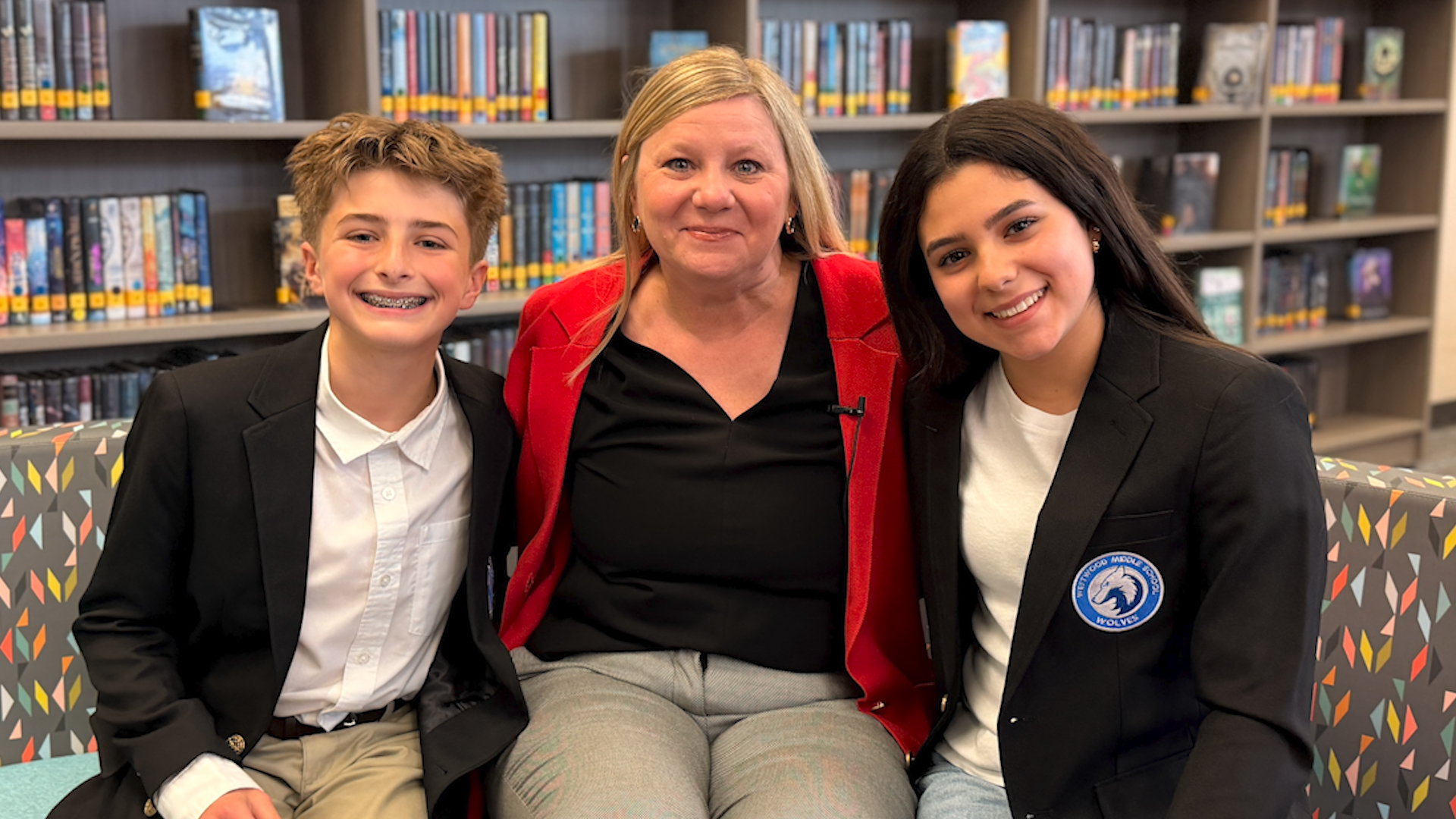 Superintendent Branum sitting with students from westwood JH leadership magnet