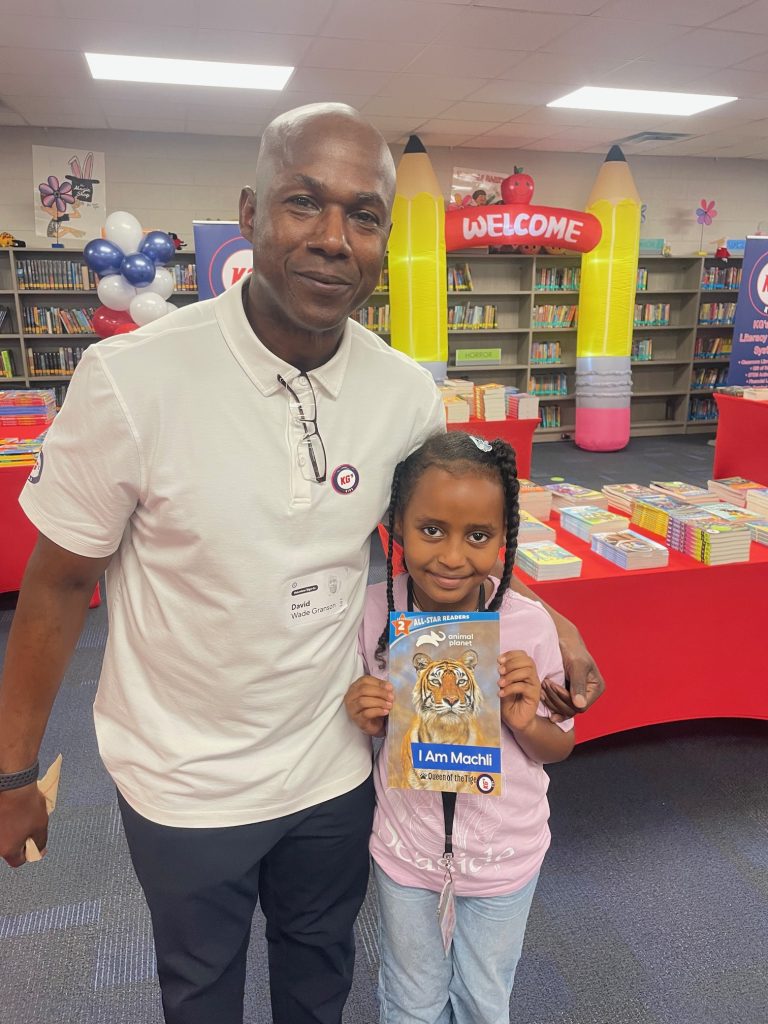 David granson with student holding new book