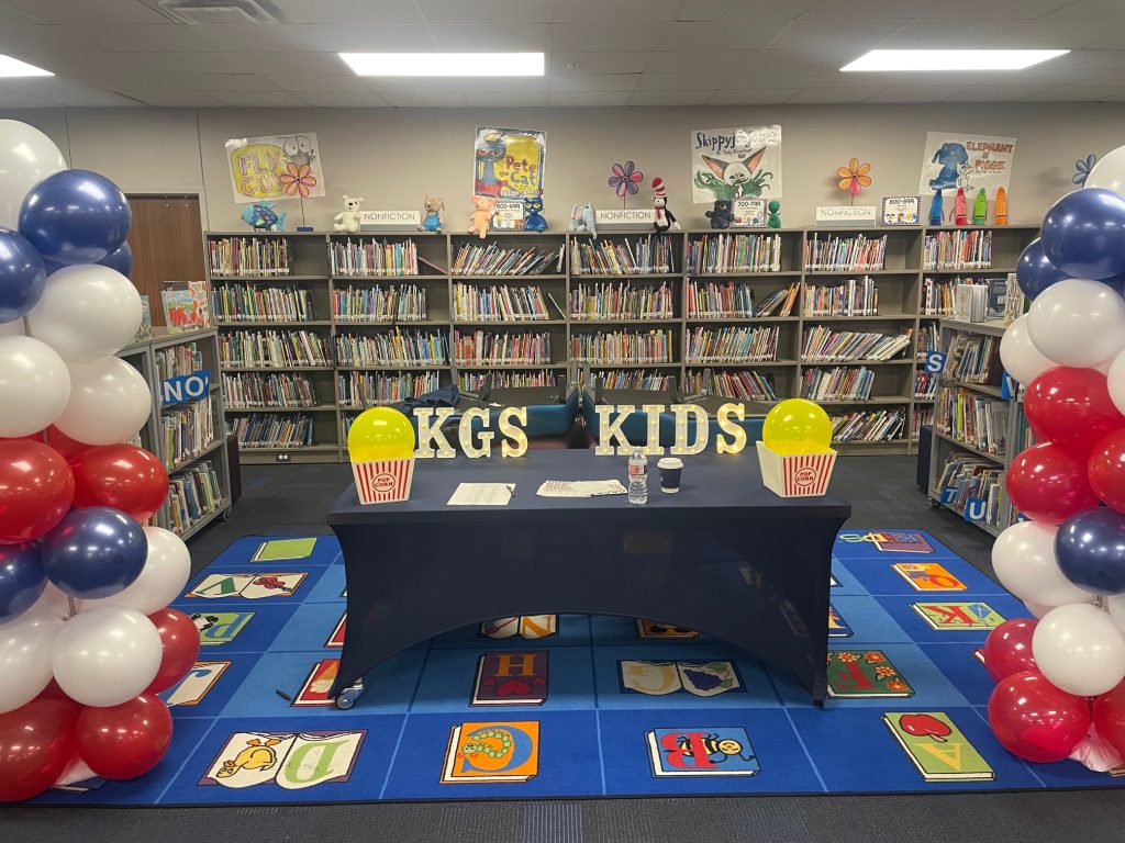 KGs kids table and balloons in library