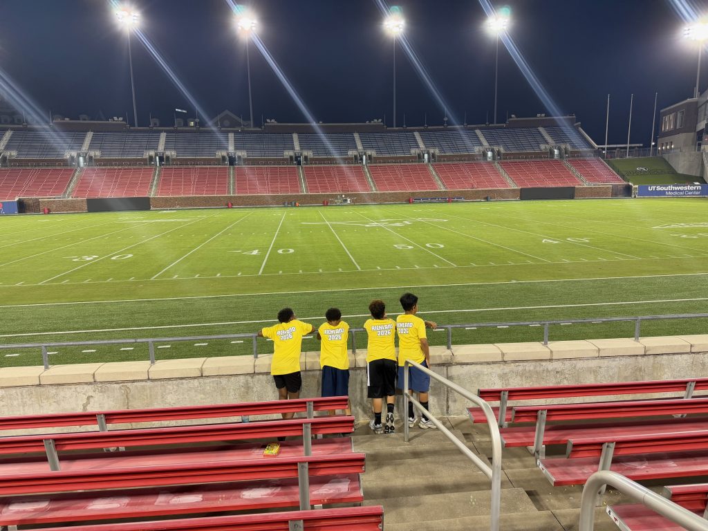 students at SMU game by the field