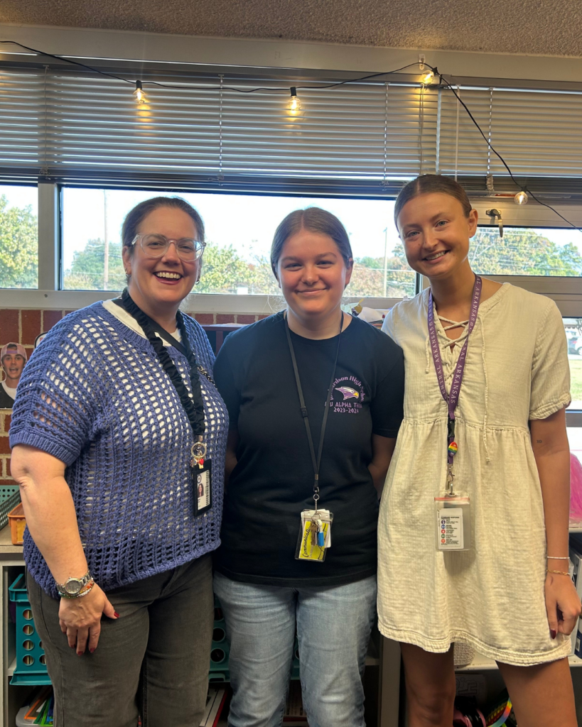 Chloe posing with Grow 2 Teach Mentor and another student