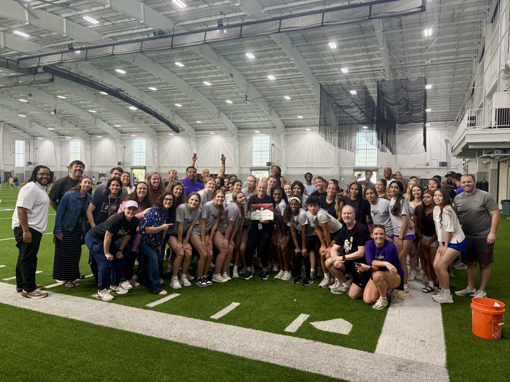Coach Cox with students and award