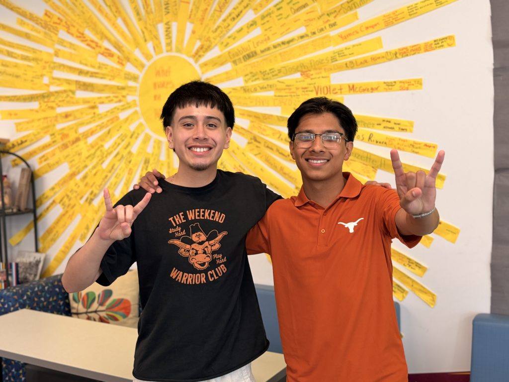 Jose and Vincent wearing UT Shirts with longhorn hand signal