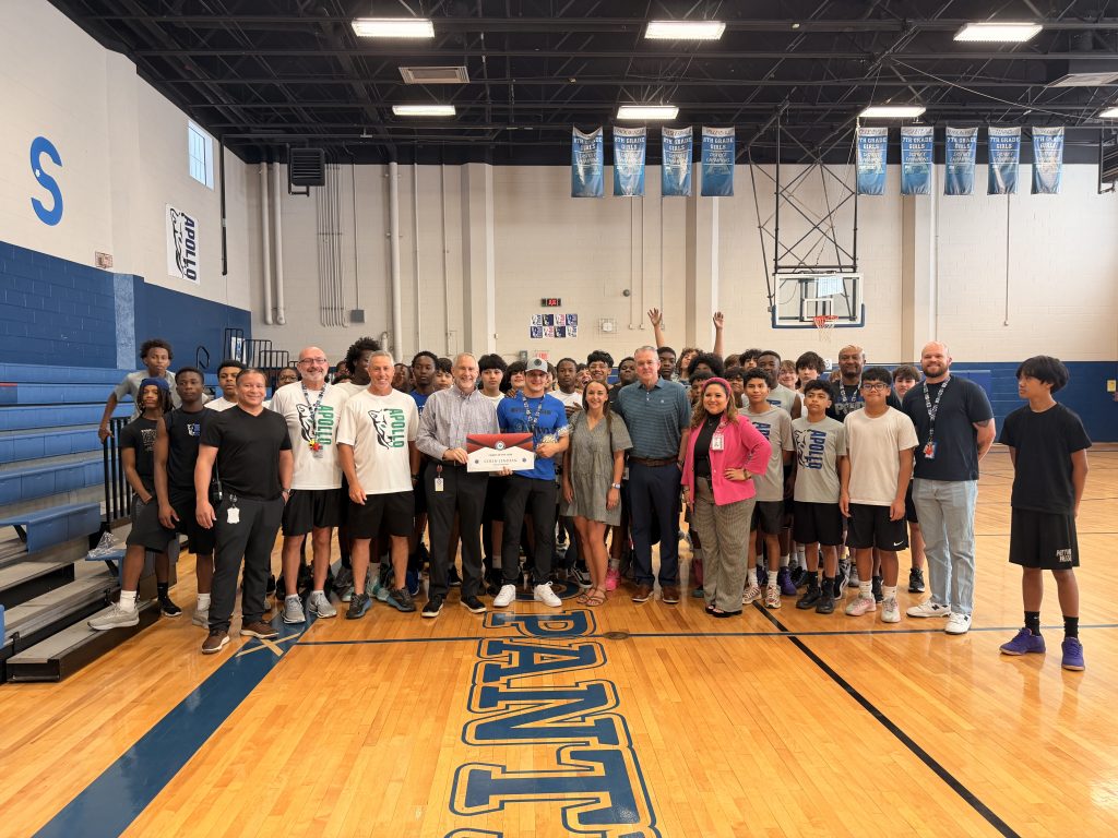 Coach Lenihan with students and award
