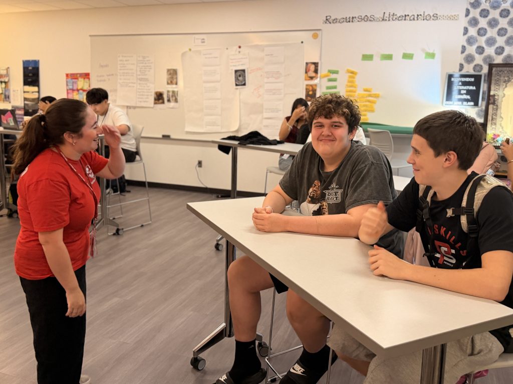Female SOS Lifeguard laughing with freshmen