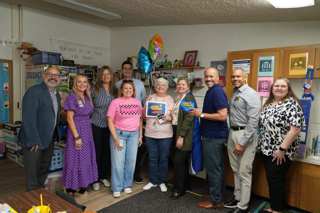 Laura Patterson, Northwood Hills Elementary with district and campus admin holding Super Teacher award