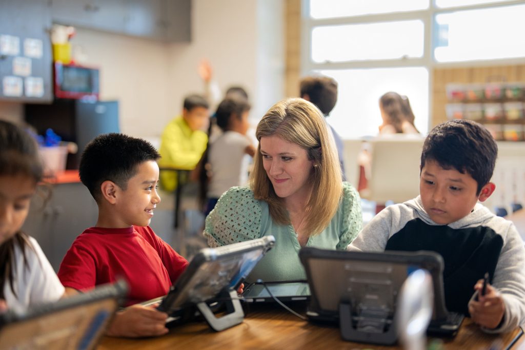 Teacher working with students