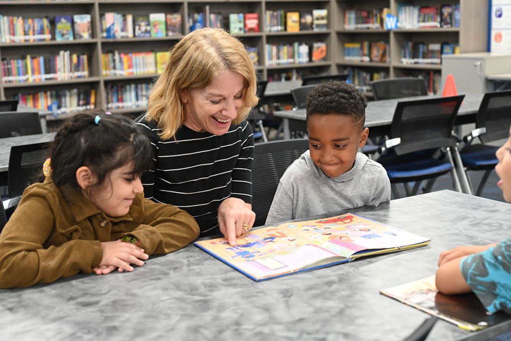 Adult reading to students